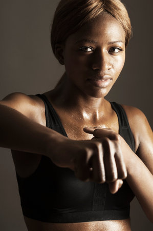 Studio portrait of woman clenching fistの写真素材