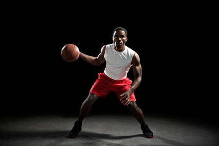Male basketball preparing to throw