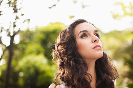 Young woman looking up, close upの写真素材
