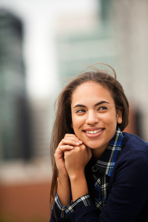 Young woman looking away, smilingの写真素材