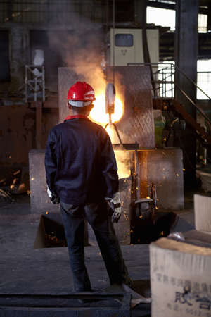 Working in cast iron foundryの写真素材