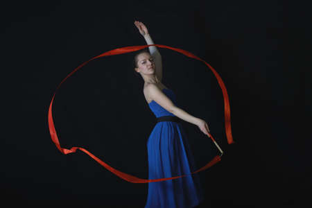 Dancer with ribbon on black backgroundの写真素材