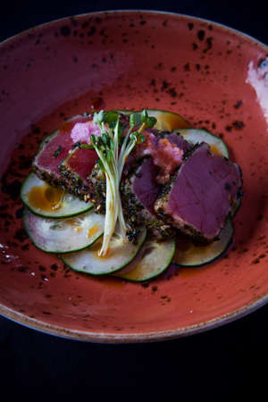 Hawaiian dish with cucumber and garnishの写真素材