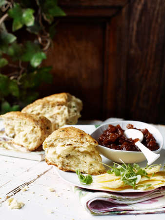 Savoury scones with spicy chutney and cheddar cheeseの写真素材
