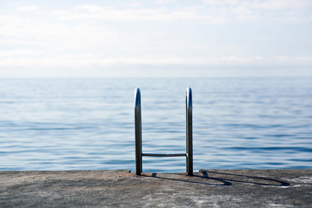 Steps on jetty by the oceanの写真素材