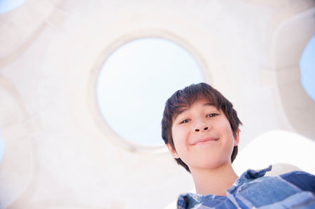 Portrait of boy smiling, low angleの写真素材