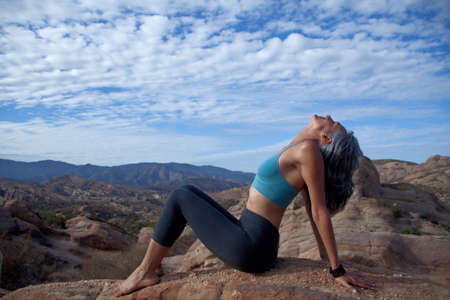 Woman sitting leaning back at Vazquez Rocks