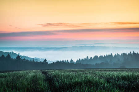 Sunset over field, Nussbaum, Baden-Wuerttemberg, Germanyの写真素材