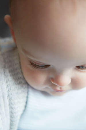 Portrait of baby boy looking downの写真素材