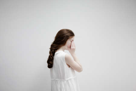 Girl posing sideways for cameraの写真素材