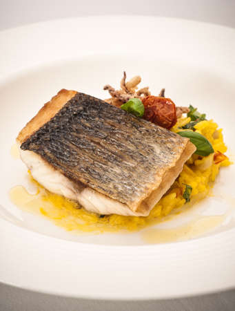 Still life with fish on bed of riceの写真素材