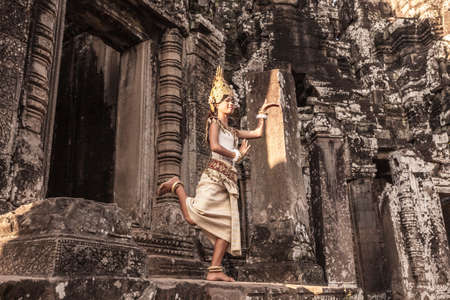 Female Apsara Dancer, standing on one leg, Bayon Temple, Angkor Thom, Cambodiaの写真素材