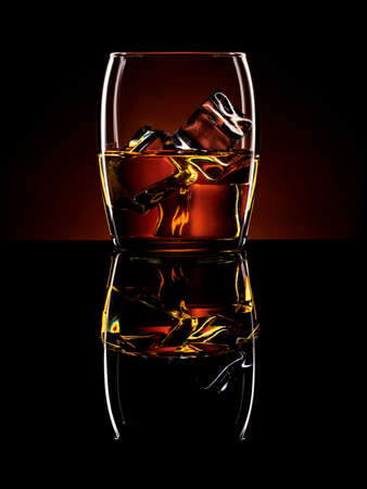 Still life of alcoholic drink with ice cubesの写真素材