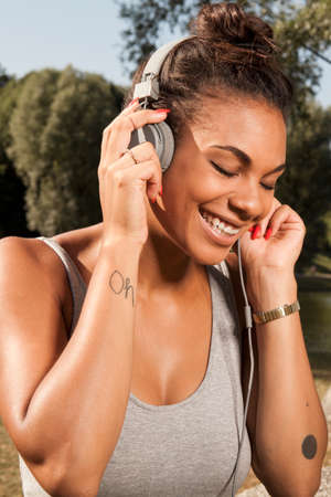 Young woman enjoying music on her headphones