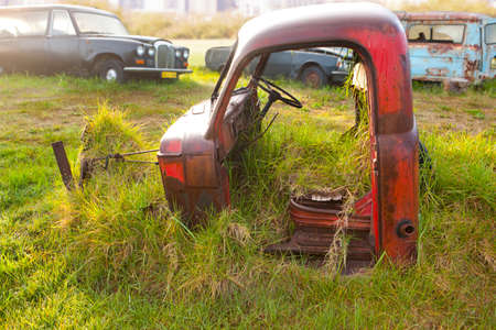 Front part of vintage car in scrap yardの写真素材