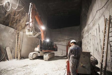 Worker and excavator in a marble quarryImage downloaded by   at 13:39 on the 13/06/15の写真素材