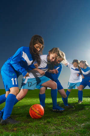 Young women playing footballの写真素材