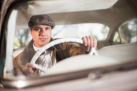 Close up of man in vintage carの写真素材
