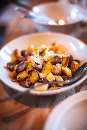 Bowl of gnocchi on tableの写真素材