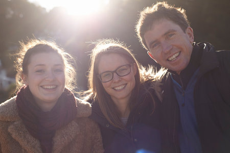 Friends on day trip in Devon, UK wearing winter clothing