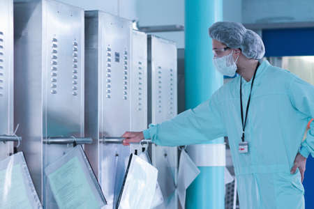 Laboratory technician making observations