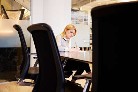 Young woman working at tableの写真素材