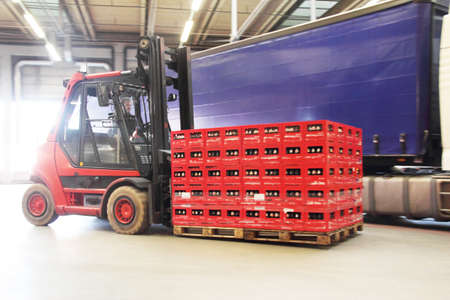 Man driving fork lift truck in brewery