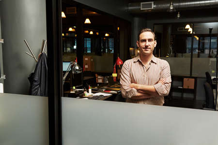 Portrait of businessman with arms foldedの写真素材