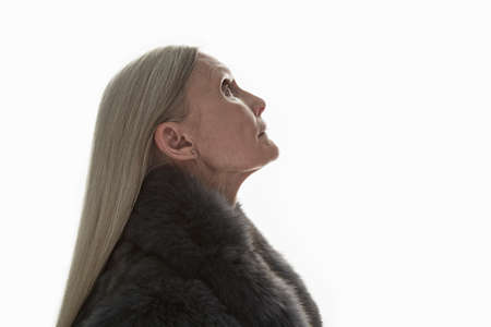 Studio shot of mature woman in profile