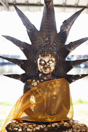 Buddhist statue covered with transparent ribbon, Bangkok, Thailandの写真素材