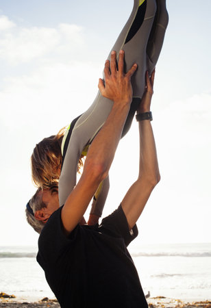 Father and daughter having fun at beach, Encinitas, California, USAの写真素材