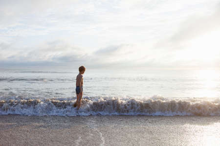 Boy going for swim in sea