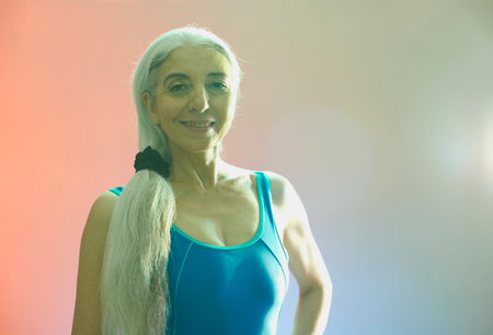 Mature woman with long grey pony tail