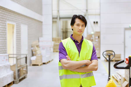 Portrait of male warehouse worker in distribution warehouse