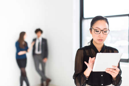 Young woman using digital tablet