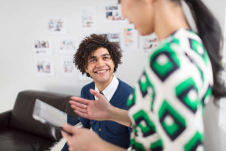 Two colleagues using digital tabletの写真素材