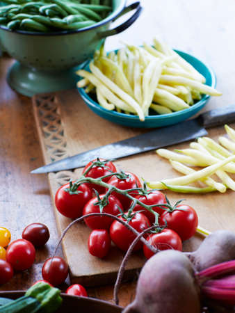 Still life of fresh vegetables with vine tomatoes, zucchini and beetrootの写真素材