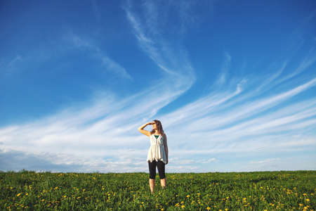 Young woman standing in field