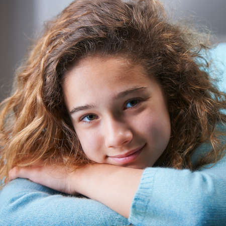 Young girl with brown hair ,smiling, portraitの写真素材
