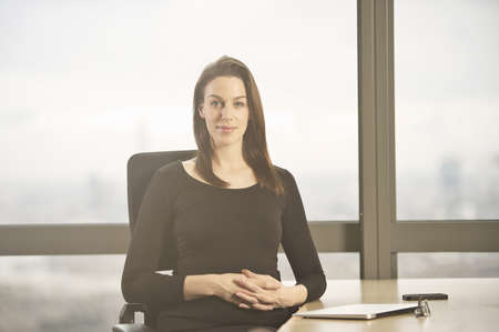 Portrait of businesswoman at office desk