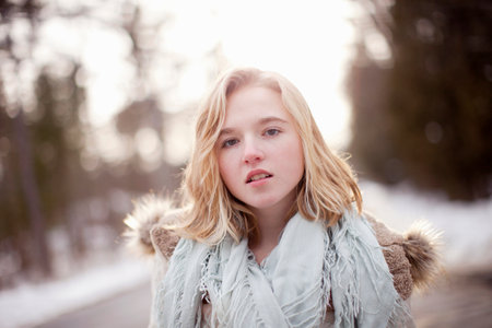 Portrait of young woman in forestの写真素材