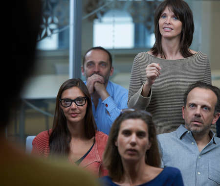 Woman standing in middle of group