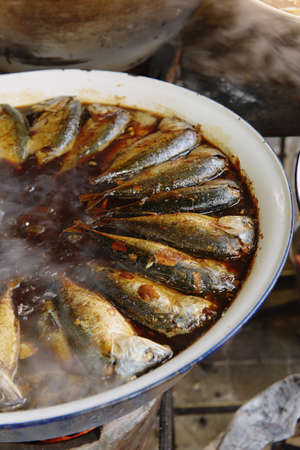 Fish cooking in street market, Bangkok, Thailandの写真素材