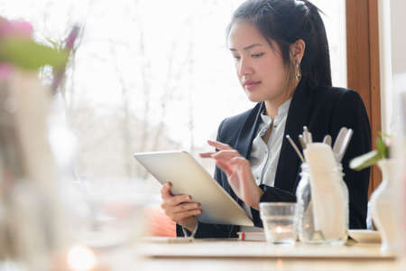 Business woman using digital tablet