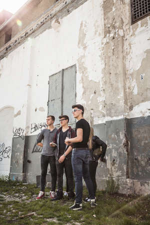 Teenagers hanging out at abandoned buildingの写真素材
