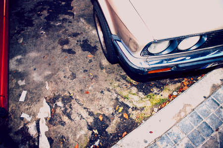 High angle cropped image of car parked next to kerbの写真素材