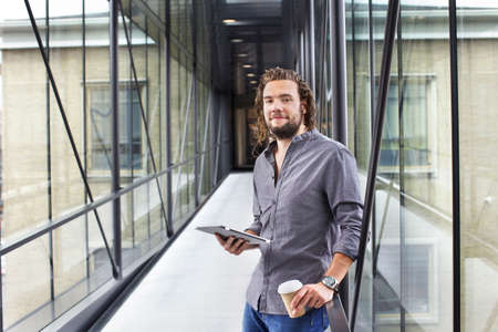 Man with digital tablet on coffee break