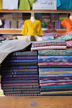 Piles of longyi cloth in shop, Nyaung Shwe, Inle Lake, Burmaの写真素材
