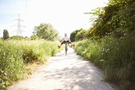 Cyclist cycling on path