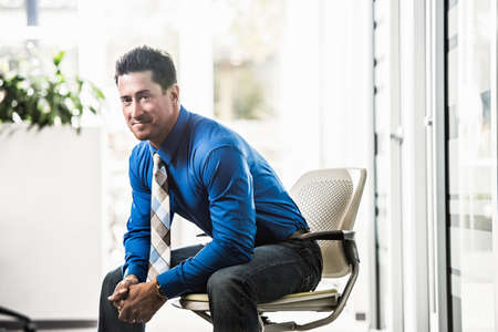 Portrait of mid adult businessman in office